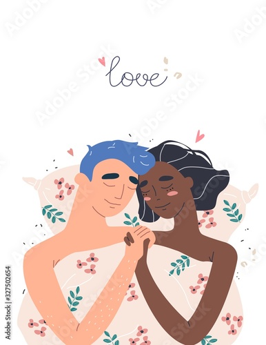 Lovers man and woman hug lying in bed . Happy multiracial family concept.