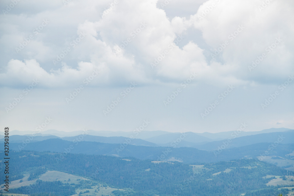 natural background of hilly mountains and sky