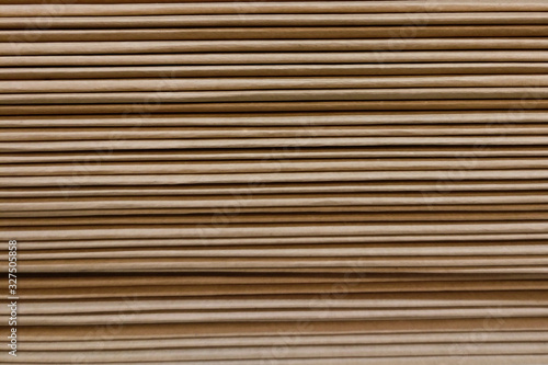 Background in the form of a brown stack of cardboard