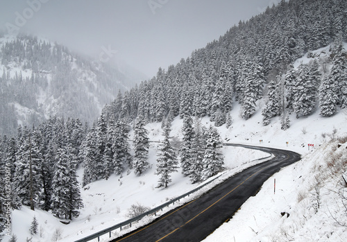 scenic view of empty road with snow covered landscape while snowing in winter season.Savsat/turkey