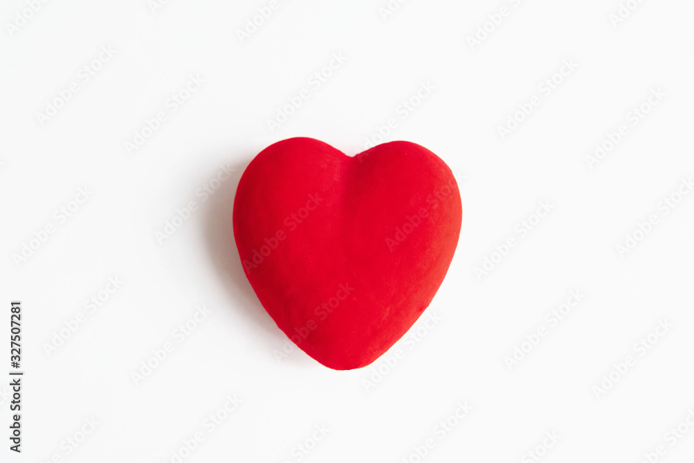 Red velvet fabric on heart form isolated on white background. Red velvet fabric on heart form isolated on white background.