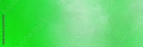 vintage abstract painted background with pastel green, lime green and pale green colors and space for text or image. can be used as horizontal background graphic
