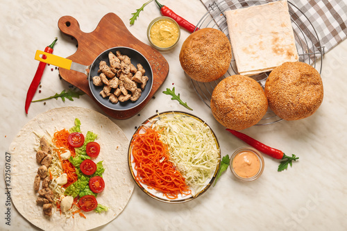 Ingredients for tasty doner kebab on table