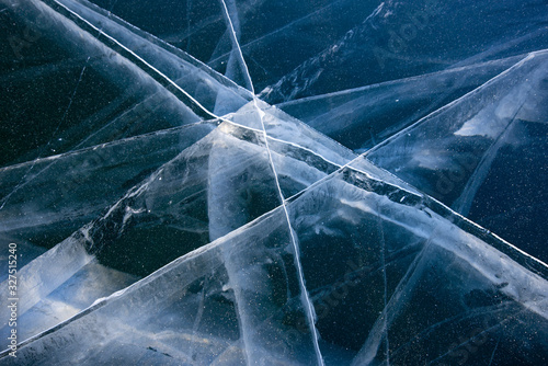 Methane Bubbles in the Baikal Ice.ice and cracks on the surface of Lake Baikal, Winter.Top view. Winter texture.Air bubbles in ice.Baikal ice. Crystal clear drinking water. 