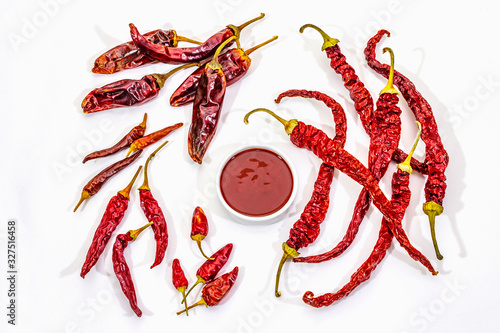 Fotografie Spicy chili sauce in bowl isolated on white background