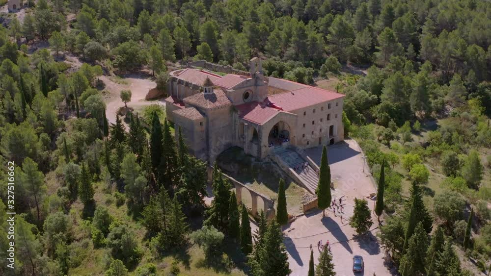 Aerial view around Saint Salvador Monastery (also Convent of Angels). Schoolchildren entering the front door to receive monks' class. Horta de Sant Joan, Tarragona province, Spain Aerial view around Saint Salvador Monastery (also Convent of Angels). Schoolchildren entering the front door to receive monks' class. Horta de Sant Joan, Tarragona province, Spain