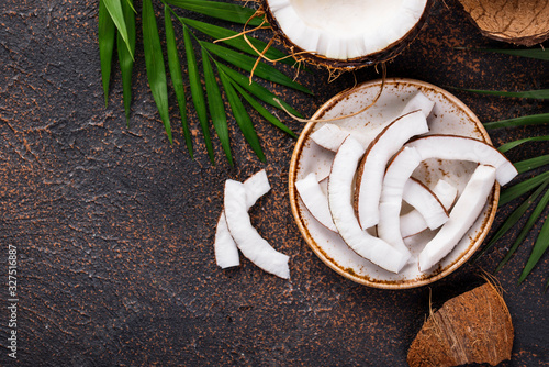 Sliced coconut and palm leaves