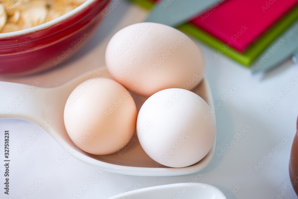 Top view, country eggs in porcelain bowl Top view, country eggs in porcelain bowl