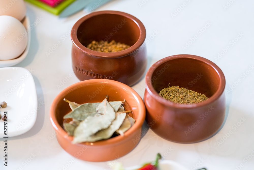 Top view, kitchen table lifestyle with different spices Top view, kitchen table lifestyle with different spices