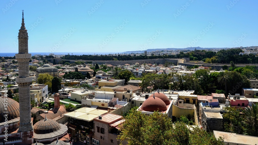 Rhodes, Greece. Aerial panoramic view, panorama of Rhodes town with buildings of the city and old walls. The Suleymaniye Mosque (Mosque of Suleiman) in the foreground 