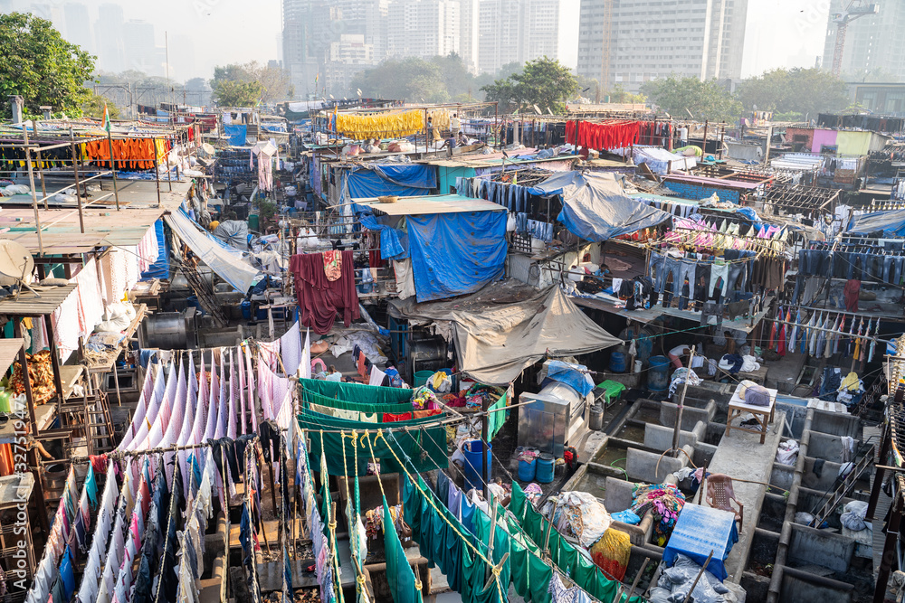 Mumbai, India - The Dhobi Ghat is a well known open air laundromat where thousands of people work daily washing and drying clothing and linens