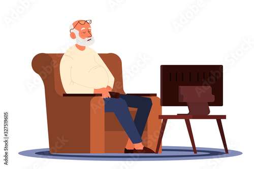 Old man sitting in an armchair and watching TV. Old people lifestyle
