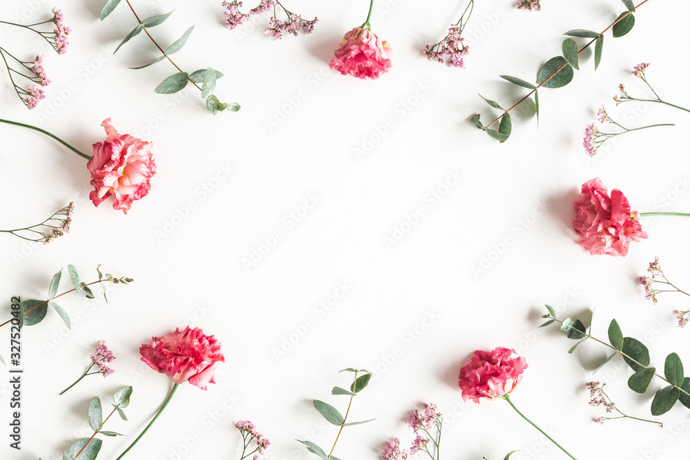 Fototapeta Flowers composition. Frame made of pink flowers and eucalyptus branches on white background. Valentines day, mothers day, womens day concept. Flat lay, top view