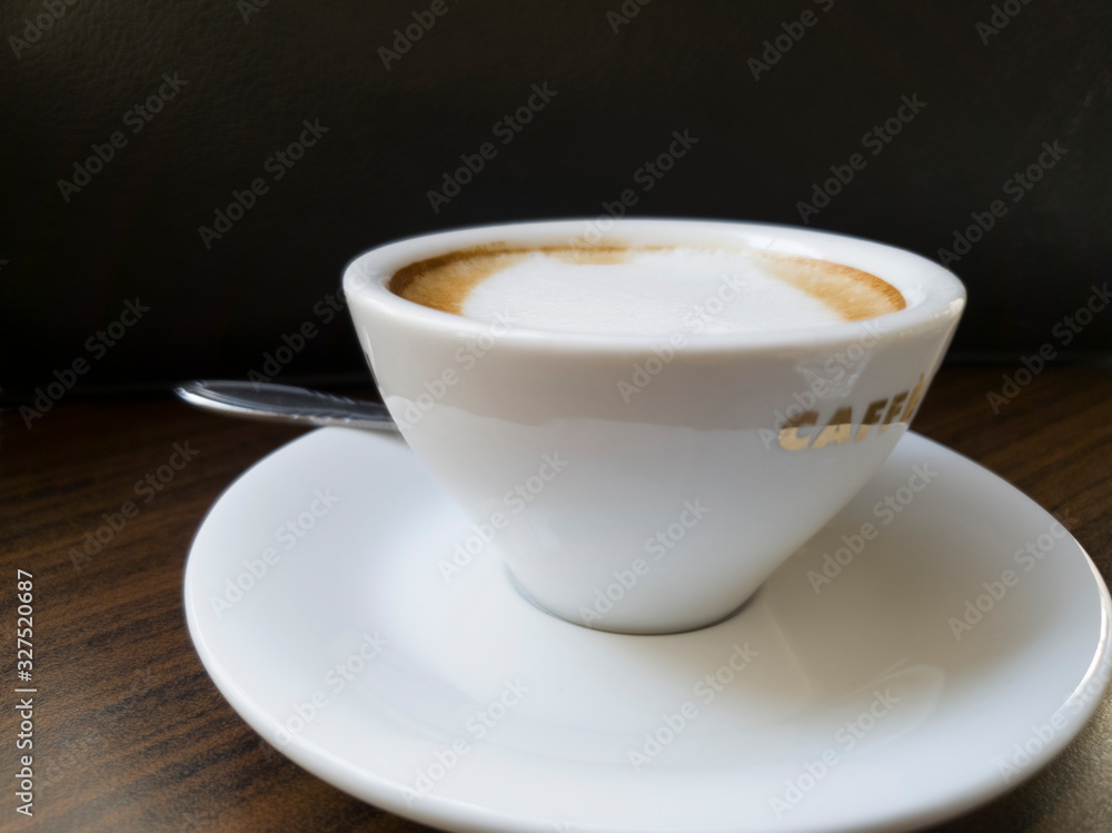 A cup of coffee in as dark background A cup of coffee in as dark background