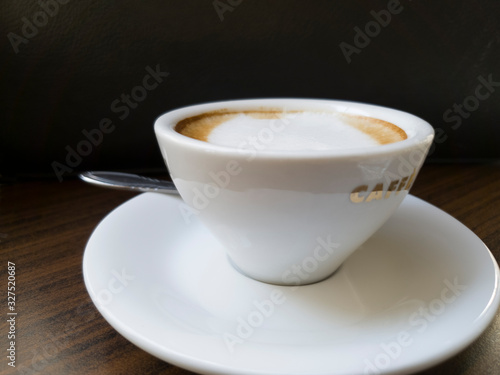 A cup of coffee in as dark background