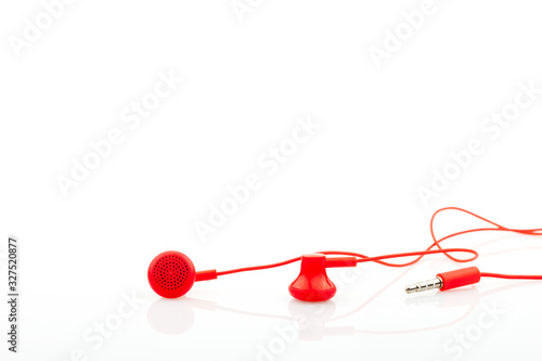 Close up Red earphone isolated on white background.