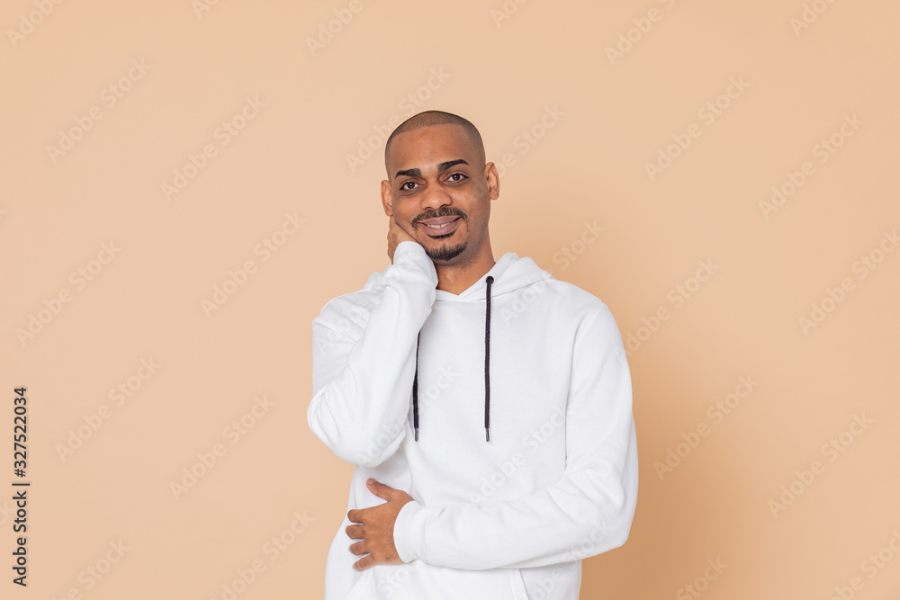 Pensive African guy with a white sweatshirt Pensive African guy with a white sweatshirt
