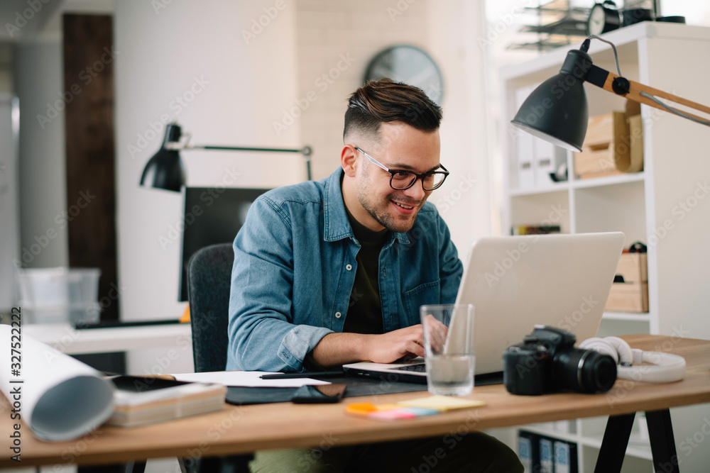 Young businessman working on project. Handsome architect in office. Young businessman working on project. Handsome architect in office.