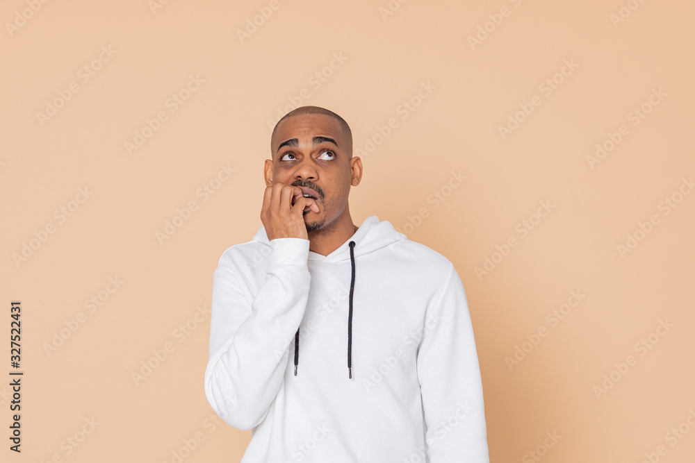 Pensive African guy with a white sweatshirt