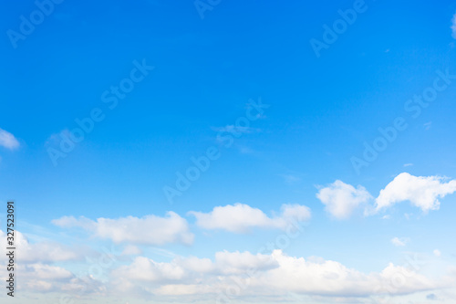 Photography chain of little cumuli clouds in blue sky