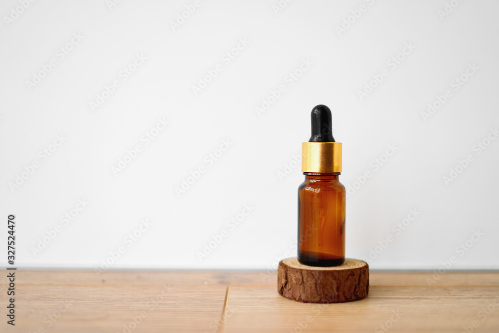 Brown bottle with dropper on white background. Essential oils or essence. Brown bottle with dropper on white background. Essential oils or essence.