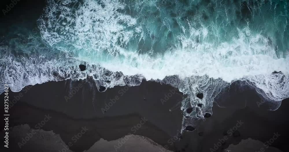 Aerial view of a beach in stormy seas 