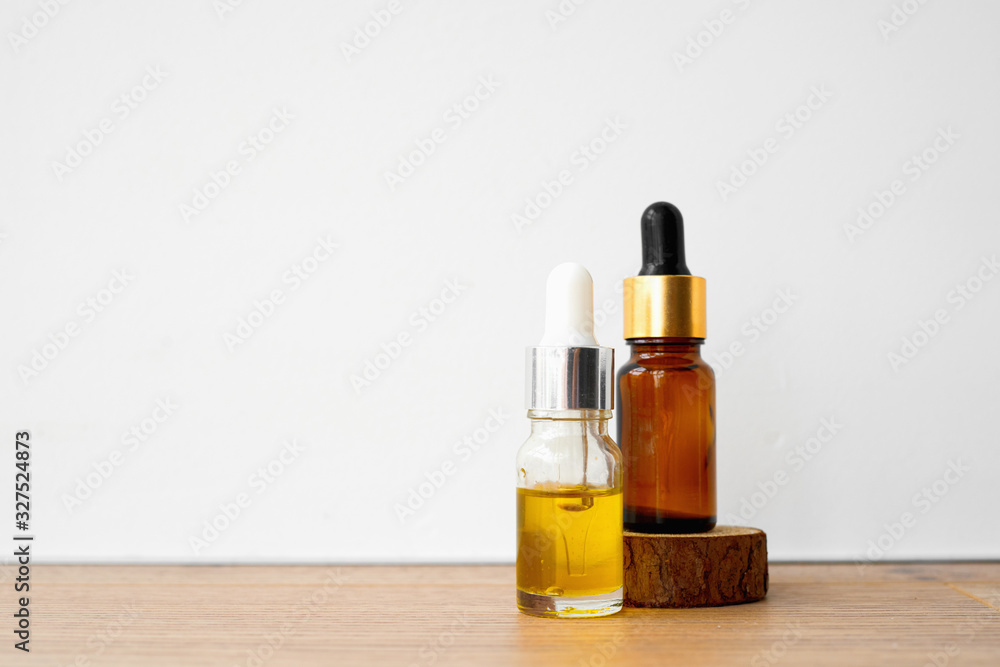 Brown bottle with dropper on white background. Essential oils or essence. Brown bottle with dropper on white background. Essential oils or essence.