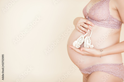 Young attractive pregnant woman indoors. Maternity concept.