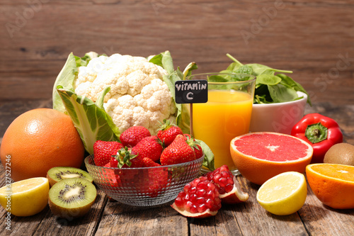 assorted of food high in vitamin c - spinach, strawberry, kiwi, orange, cauliflower photo