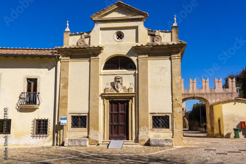 Facade of catholic church of Saint Maria Assunta in the medieval village of Santa Severa (municipality of Santa Marinella) 50 km (31 mi) north of Rome. photo