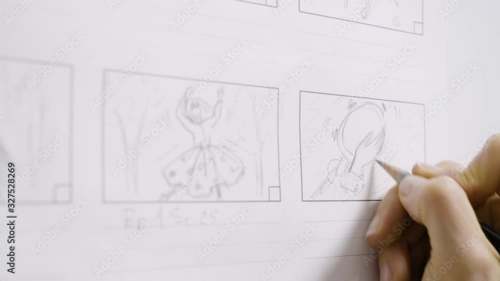 Woman's hand draws a storyboard for a film or cartoon. Woman's hand draws a storyboard for a film or cartoon.