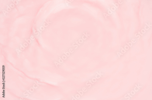 Smooth pink water with soft waves as abstract background, texture.