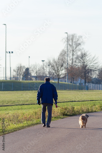 man walking wiht dog