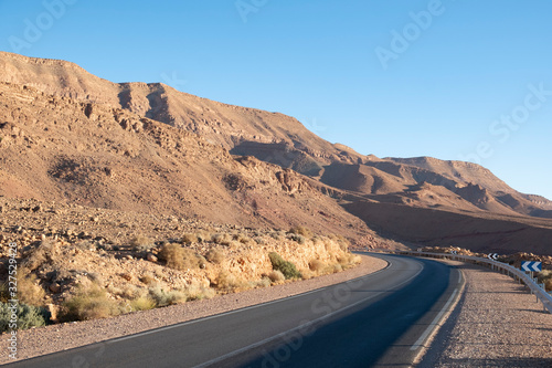 lonely road through the dry mountains of the Atlas in Morocco