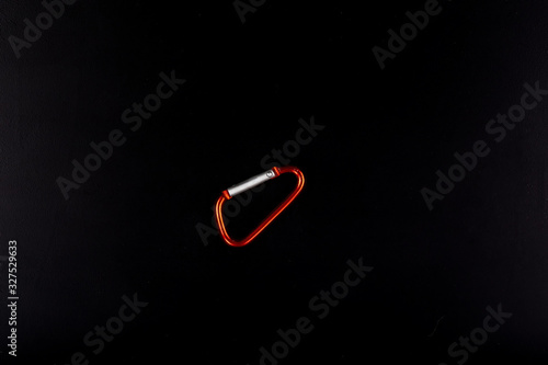 Tableau sur toile Metal carabiner isolated on a black background in full size.