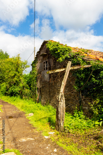 Old stone abandoned building in Outeiro, A Coruna Province, Galicia, Spain on the Way of St. James, Camino de Santiago photo