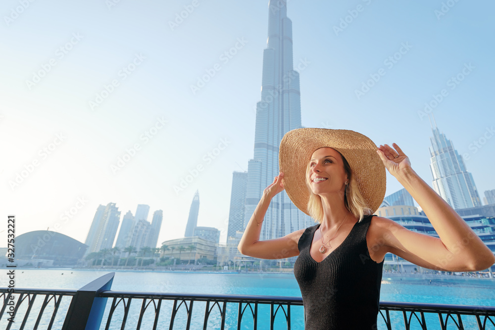 Young travelling woman enjoying the view of Dubai downtown.