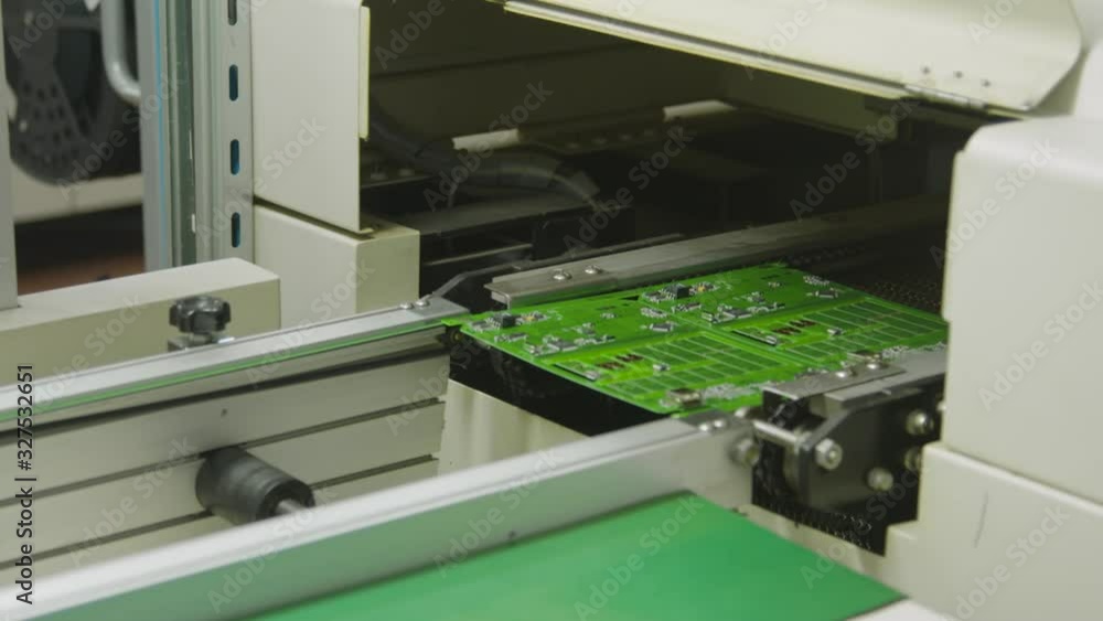 Industrial Factory machinery. Automatic mounting components on printed circuit board Industrial Factory machinery. Automatic mounting components on printed circuit board