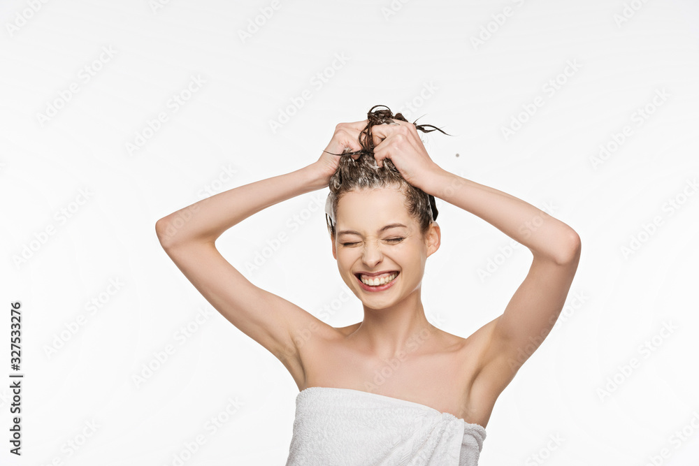 cheerful girl smiling with closed eyes while washing hair isolated on white cheerful girl smiling with closed eyes while washing hair isolated on white