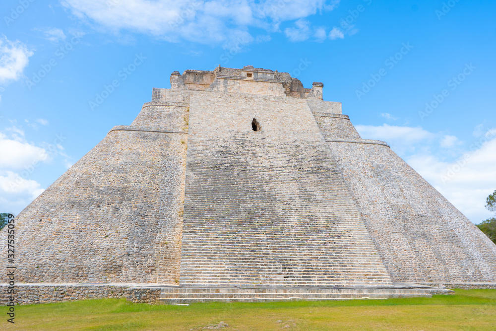 The Adivino (the Pyramid of the Magician or the Pyramid of the Dwarf). Uxmal an ancient Maya city of the classical period. Travel photo. Yucatan. Mexico. The Adivino (the Pyramid of the Magician or the Pyramid of the Dwarf). Uxmal an ancient Maya city of the classical period. Travel photo. Yucatan. Mexico.
