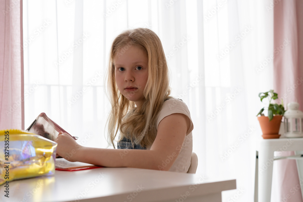 education and development. Beautiful teenage girl doing homework in her room education and development. Beautiful teenage girl doing homework in her room