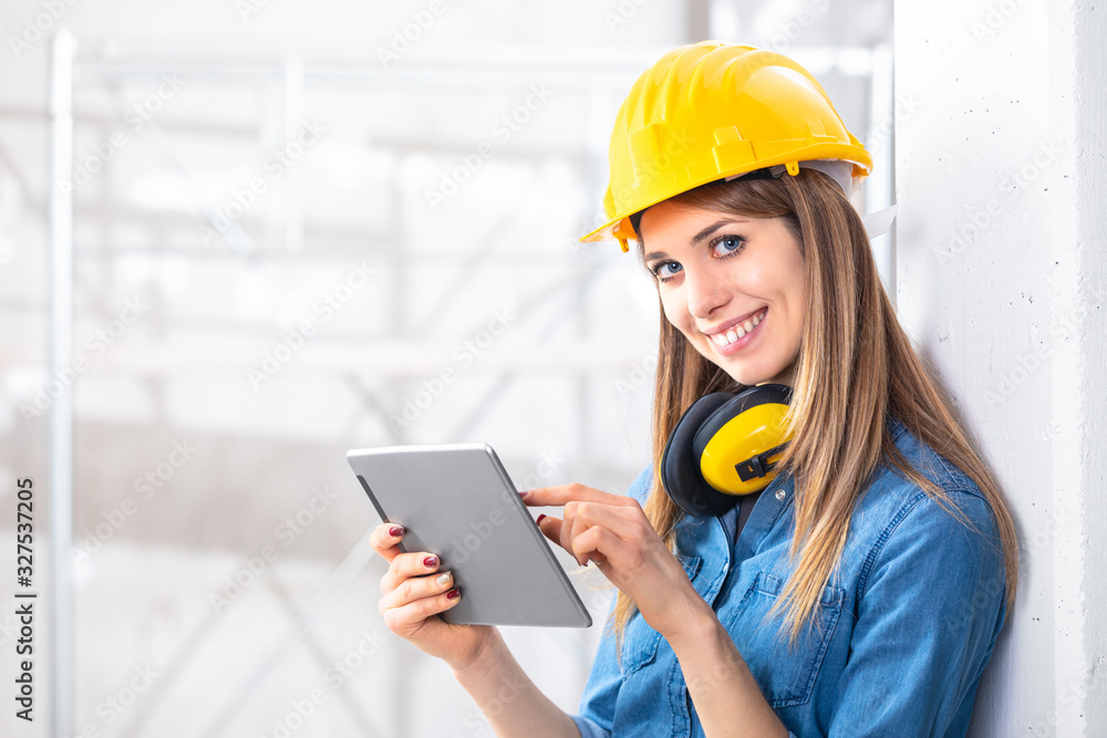 Smiling young female construction worker Smiling young female construction worker