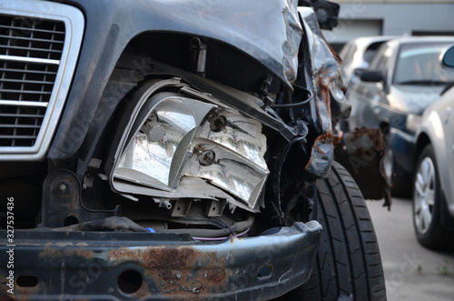 A close-up of the front black car, which was demolished by an accident