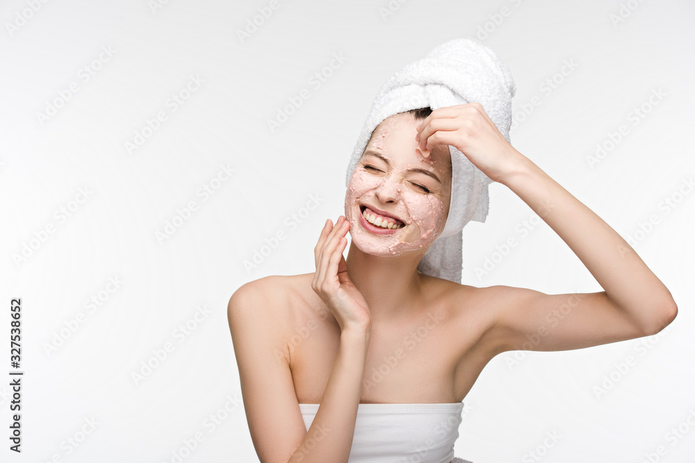 cheerful girl with closed eyes removing peeling mask from face isolated on white cheerful girl with closed eyes removing peeling mask from face isolated on white