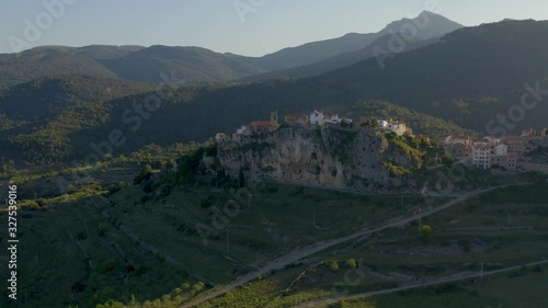 Aerial view of Chodos's village. Rural landscape of a village built on the edge of the sloping mountain, Castellon province in Valencia, Spain photo