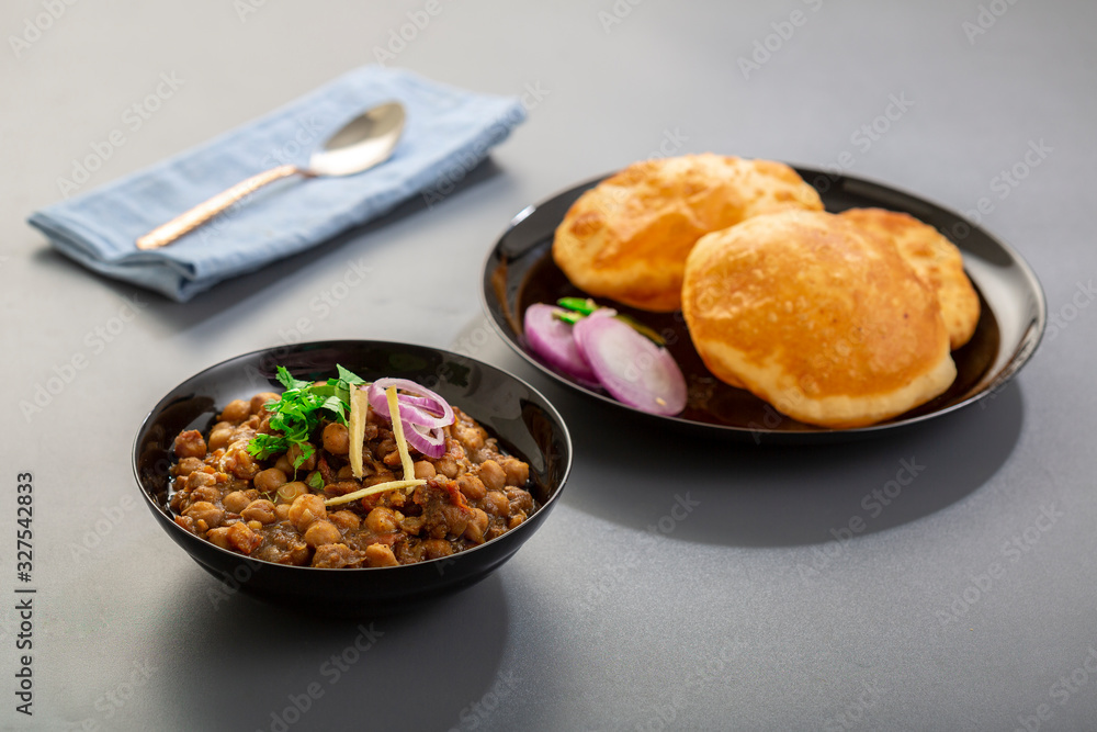choley bhature is a dish originated initially in the northern part of the Indian subcontinent.  It is a combination of chana masala and bhatura, a fried bread made from maida.