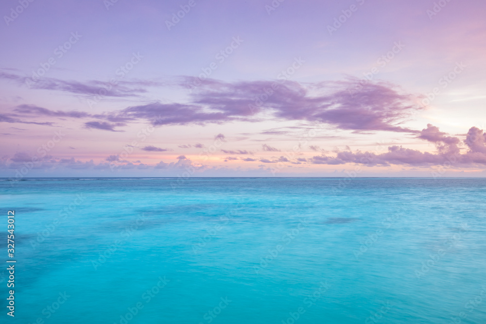 Obraz premium Peaceful, tranquil, relaxing seascape. Inspirational calm sea with sunset sky. Meditation ocean and sky background. Colorful horizon over the water