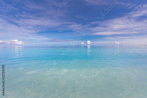 Relaxing seascape with wide horizon of the sky and the sea. Tranquil blue ocean water. 