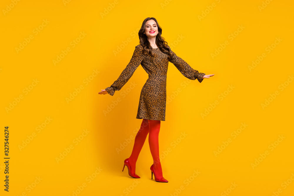Full length body size view of her she nice-looking attractive lovely luxurious glamorous cheerful cheery wavy-haired girl walking isolated over bright vivid shine vibrant yellow color background Full length body size view of her she nice-looking attractive lovely luxurious glamorous cheerful cheery wavy-haired girl walking isolated over bright vivid shine vibrant yellow color background