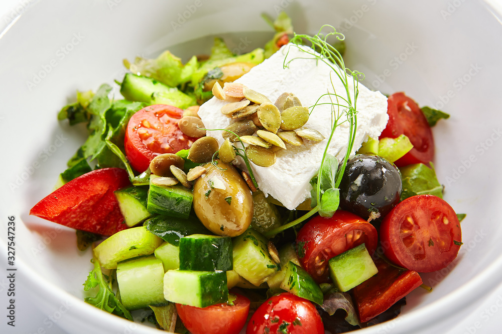 Greek salad in white bowl Greek salad in white bowl